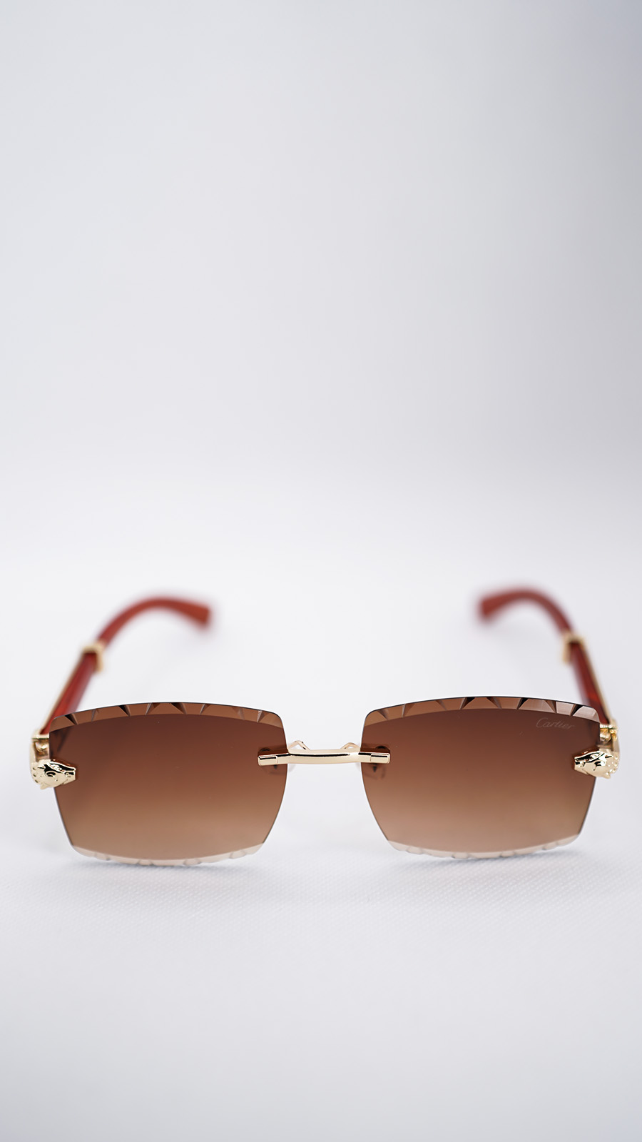 عینک آفتابی کارتیر فریم بدون قاب طلایی با عدسی گرادینت قهوه‌ای